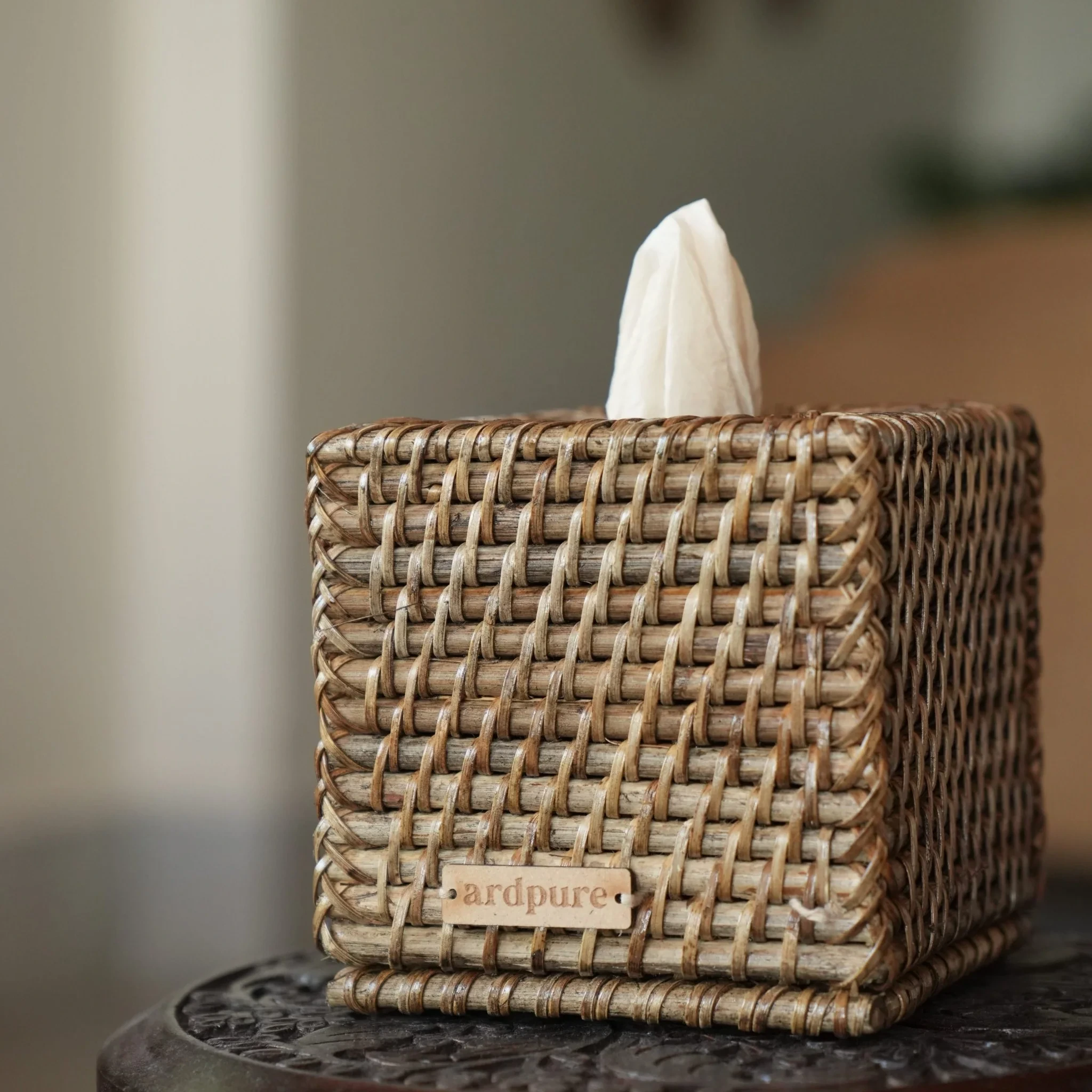 Woven tissue box holder for hotel room accessories